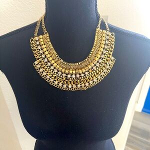 Great statement necklace there is a stone missing not noticeable great condition